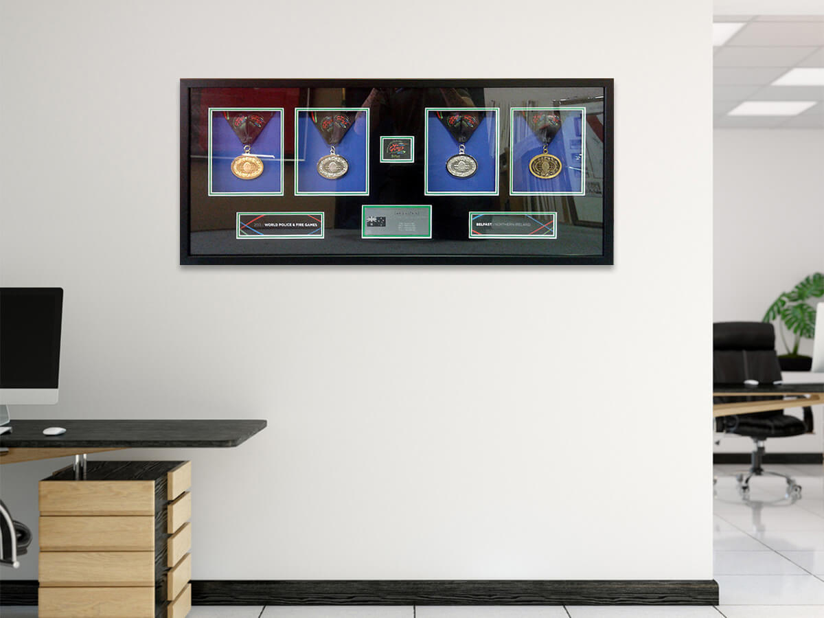 Framed corporate medals police and fire